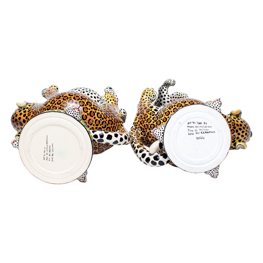 Pair of leopard urns