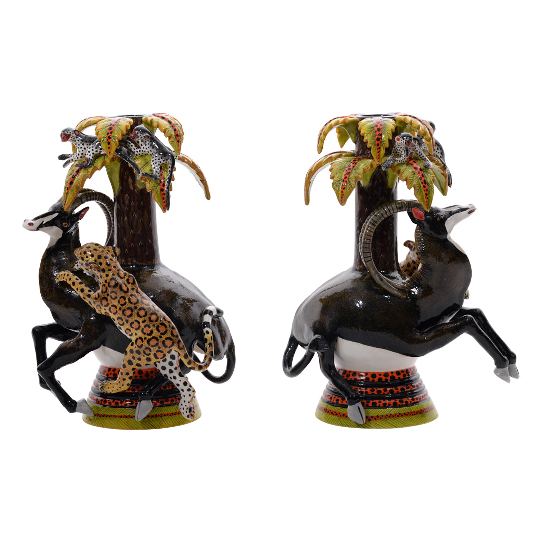 Pair of sable & leopard candlestics