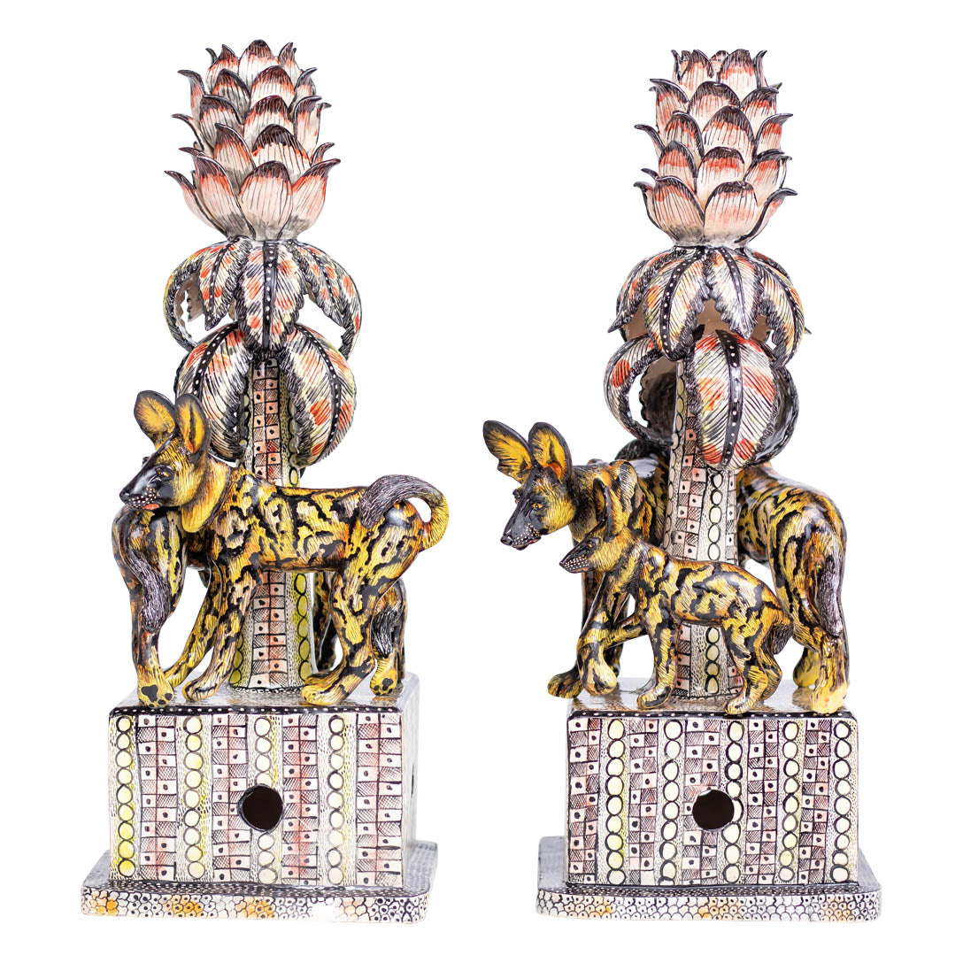 Pair of wild dog candlesticks
