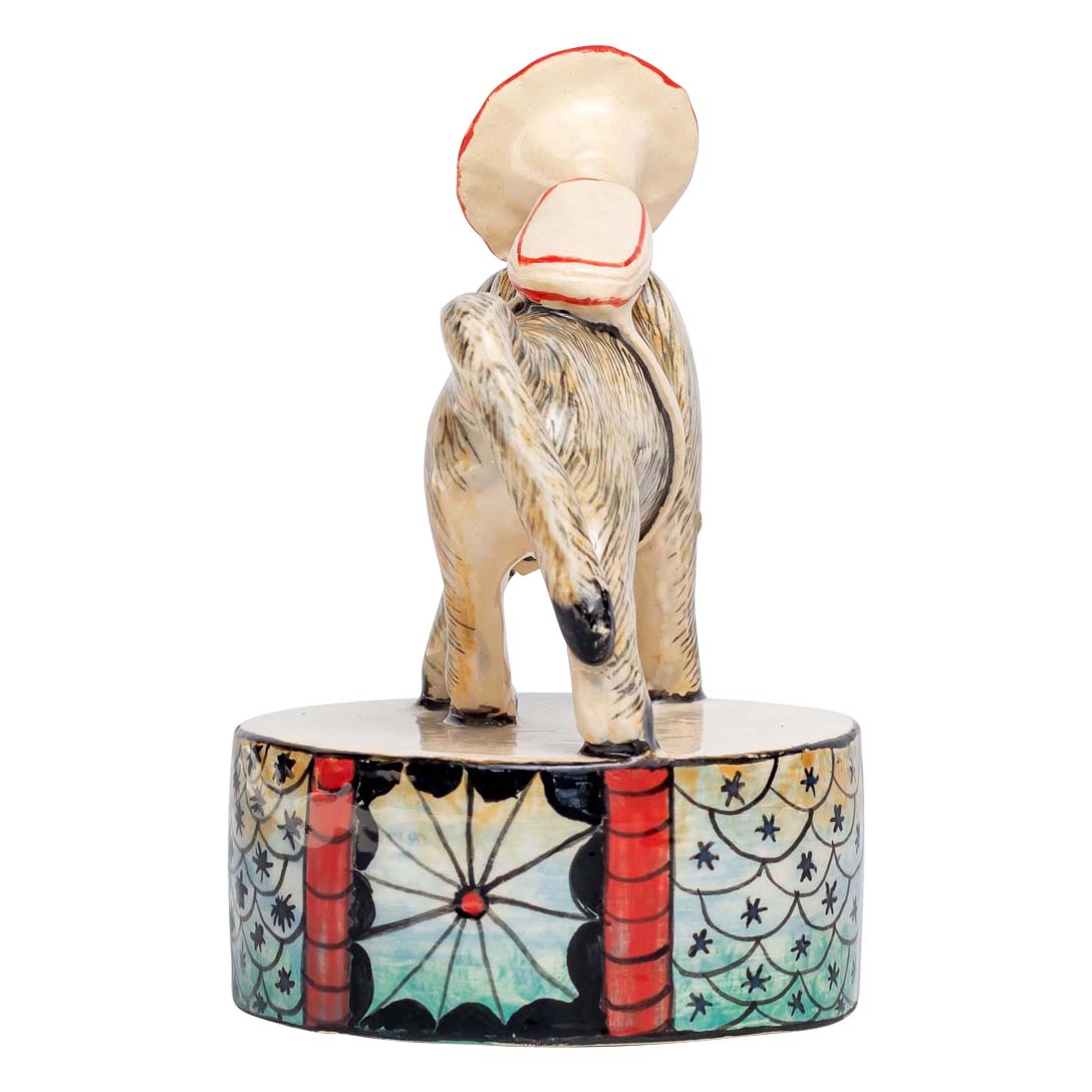 Baboon with trumpet sculpture