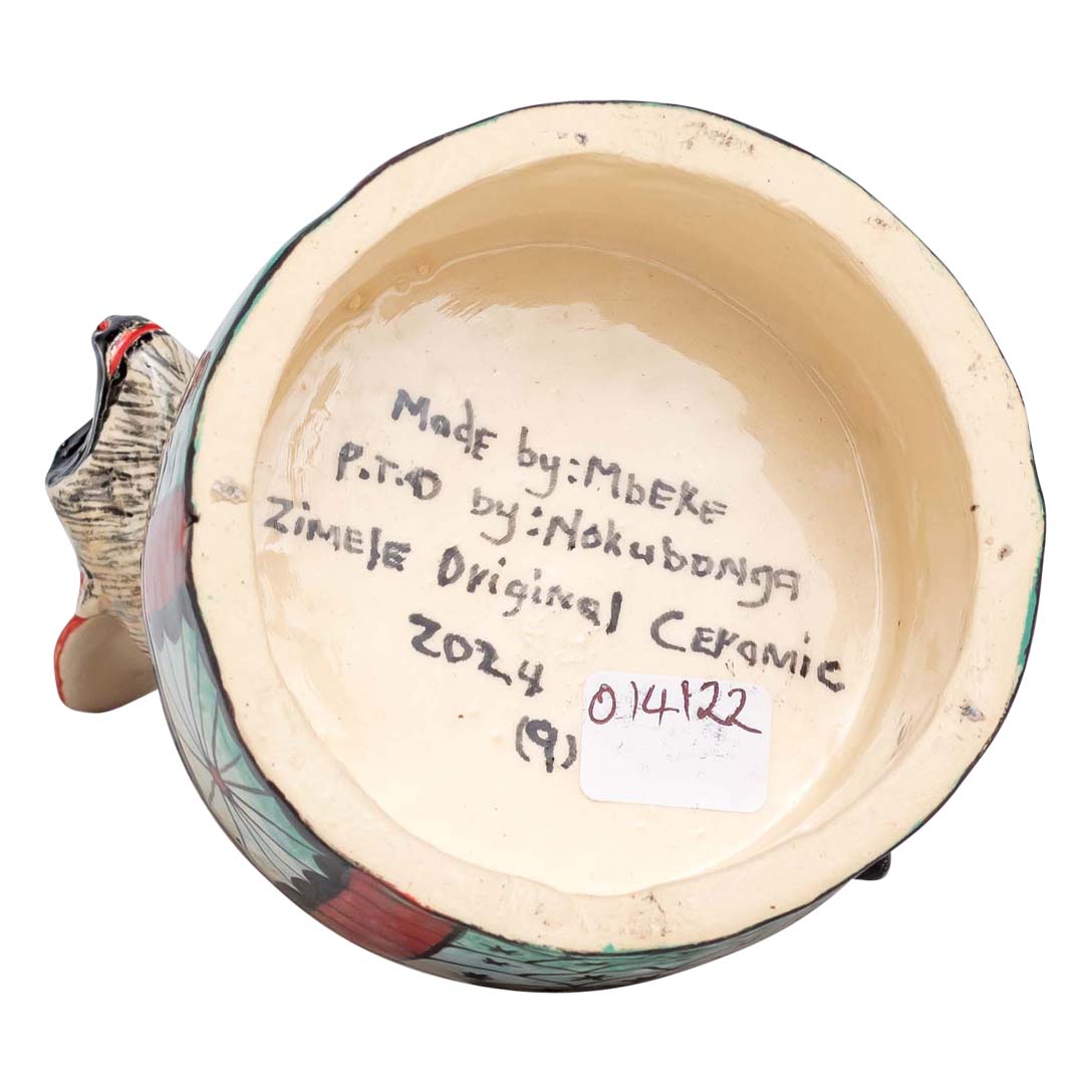 Baboon with trumpet sculpture