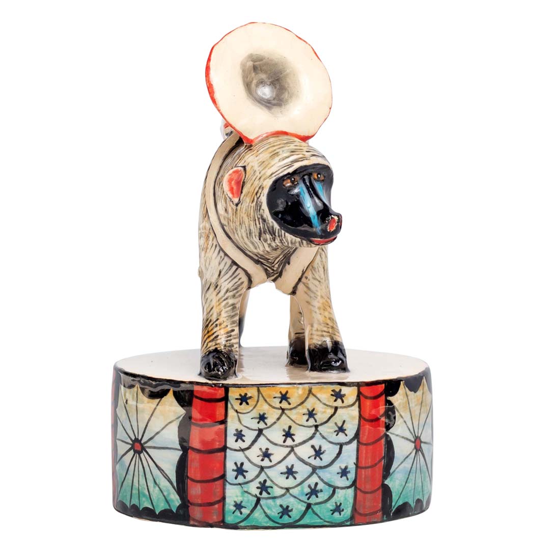 Baboon with trumpet sculpture