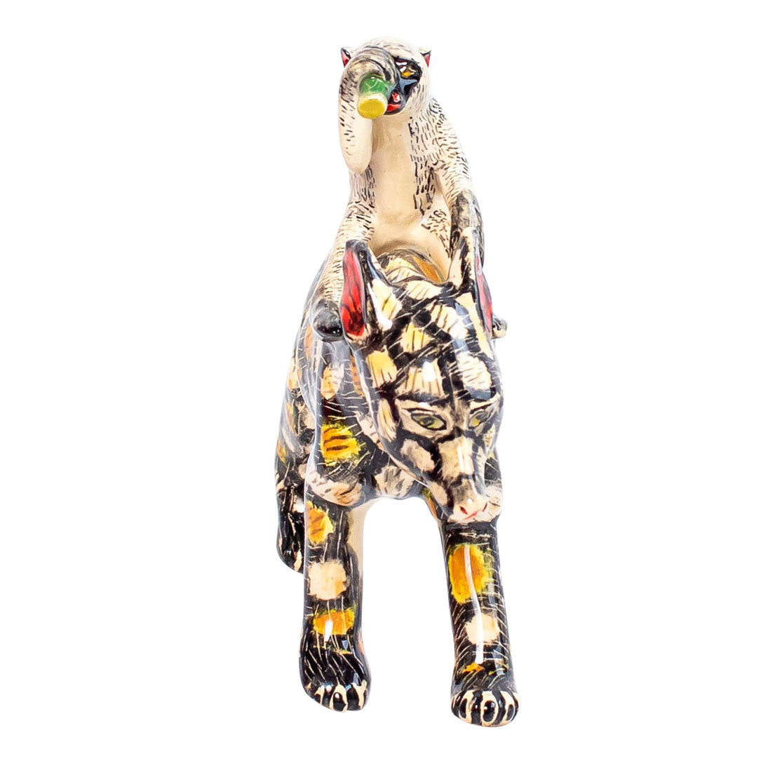 Wild dog monkey rider sculpture