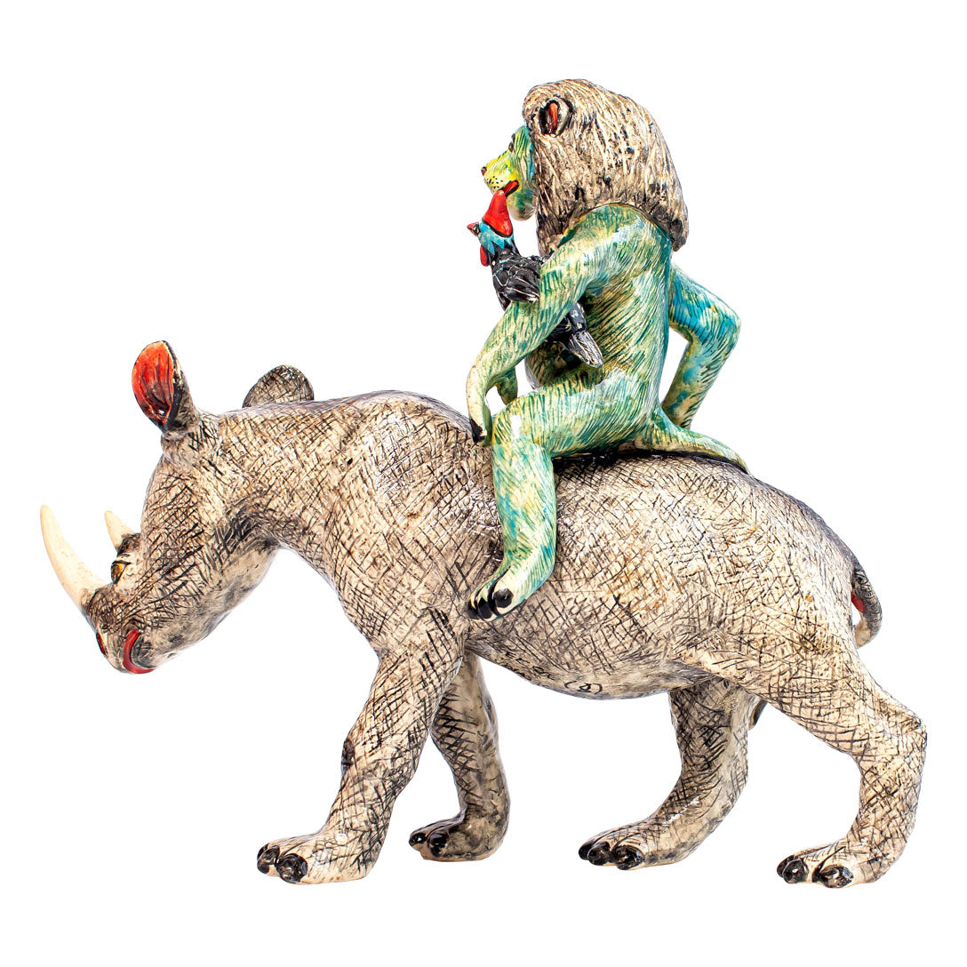 Blue rhino & lion rider sculpture