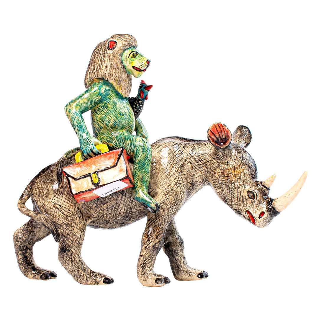 Blue rhino & lion rider sculpture