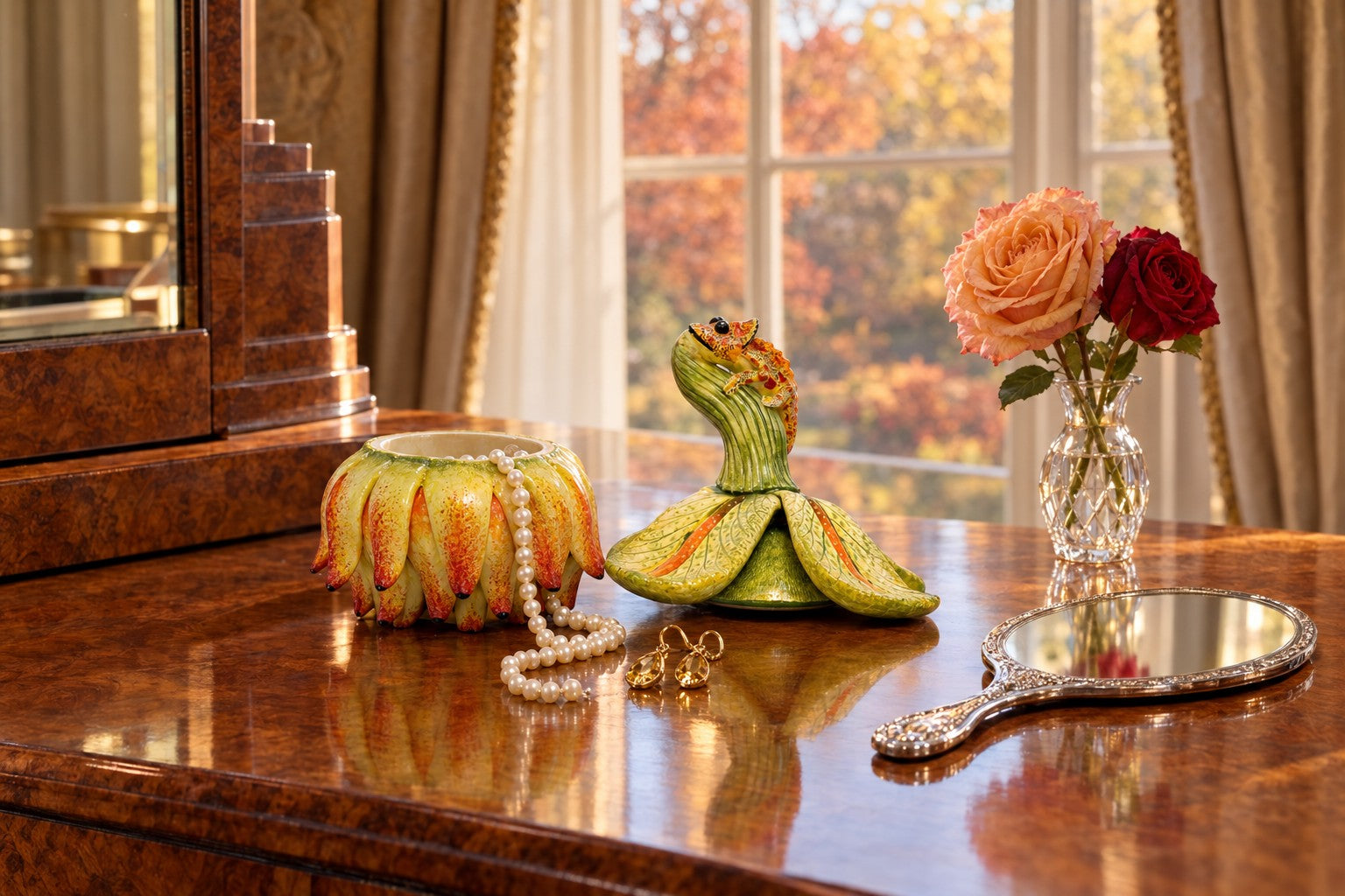 The chameleon flower jewelry box open on a burr walnut dressing table with pearls