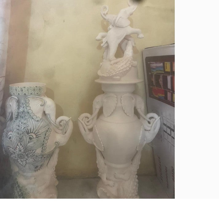 Pair of elephant urns