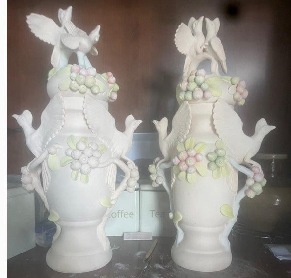 Pair of lory bird urns