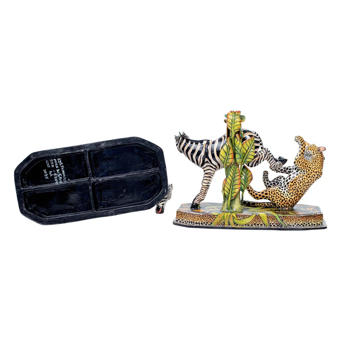 Pair of zebra & leopard candlesticks