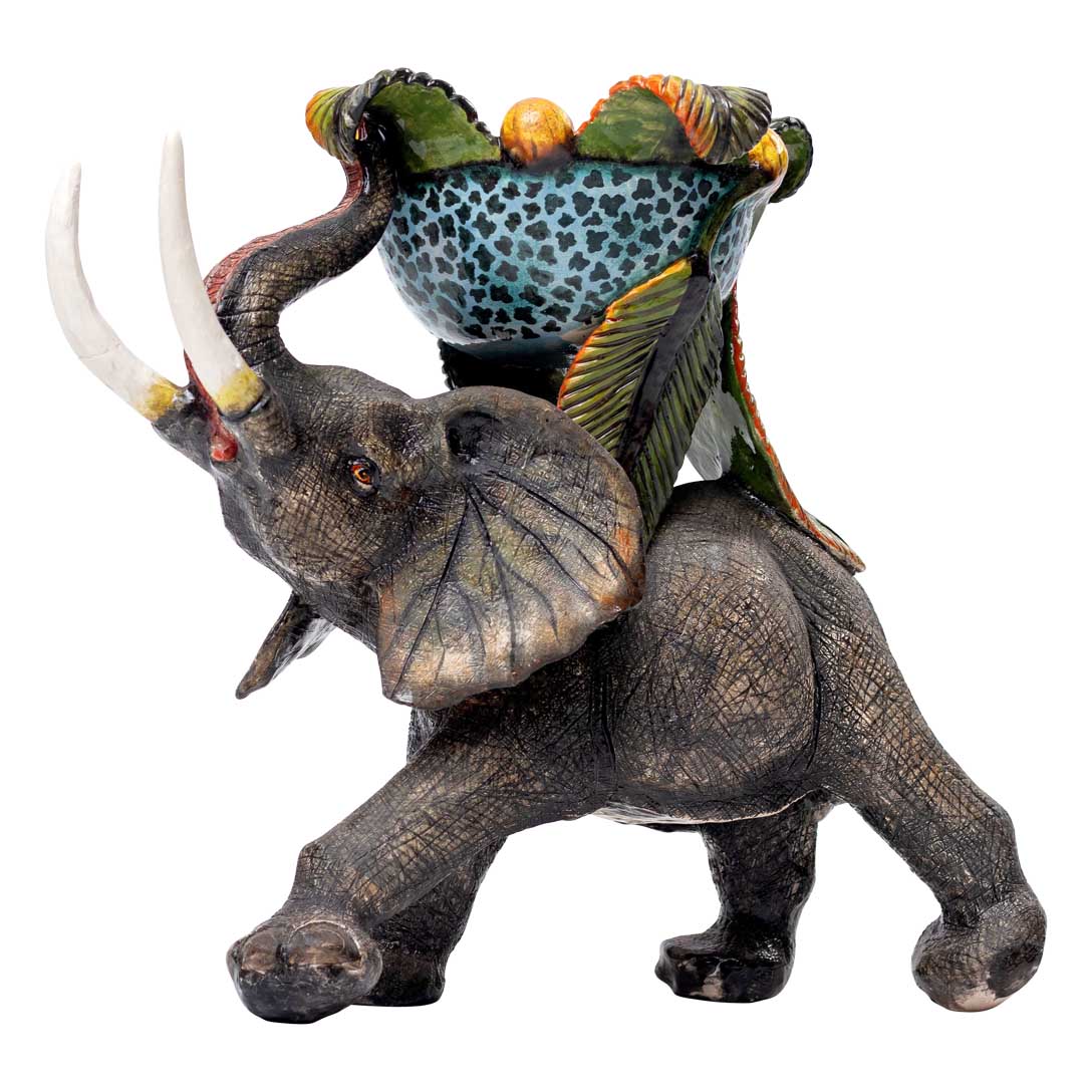 Elephant fruit hunting carrying sweet dish