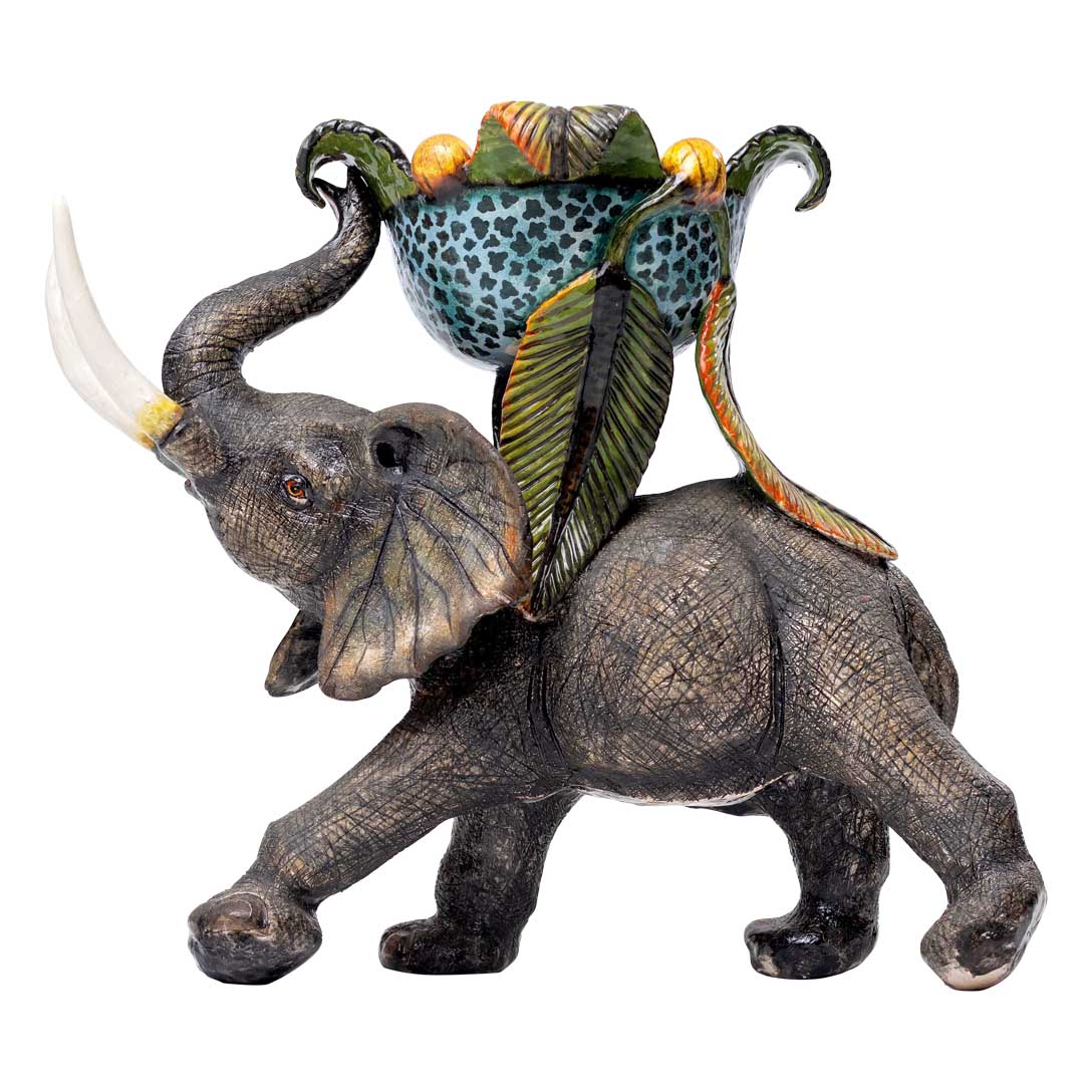 Elephant fruit hunting carrying sweet dish