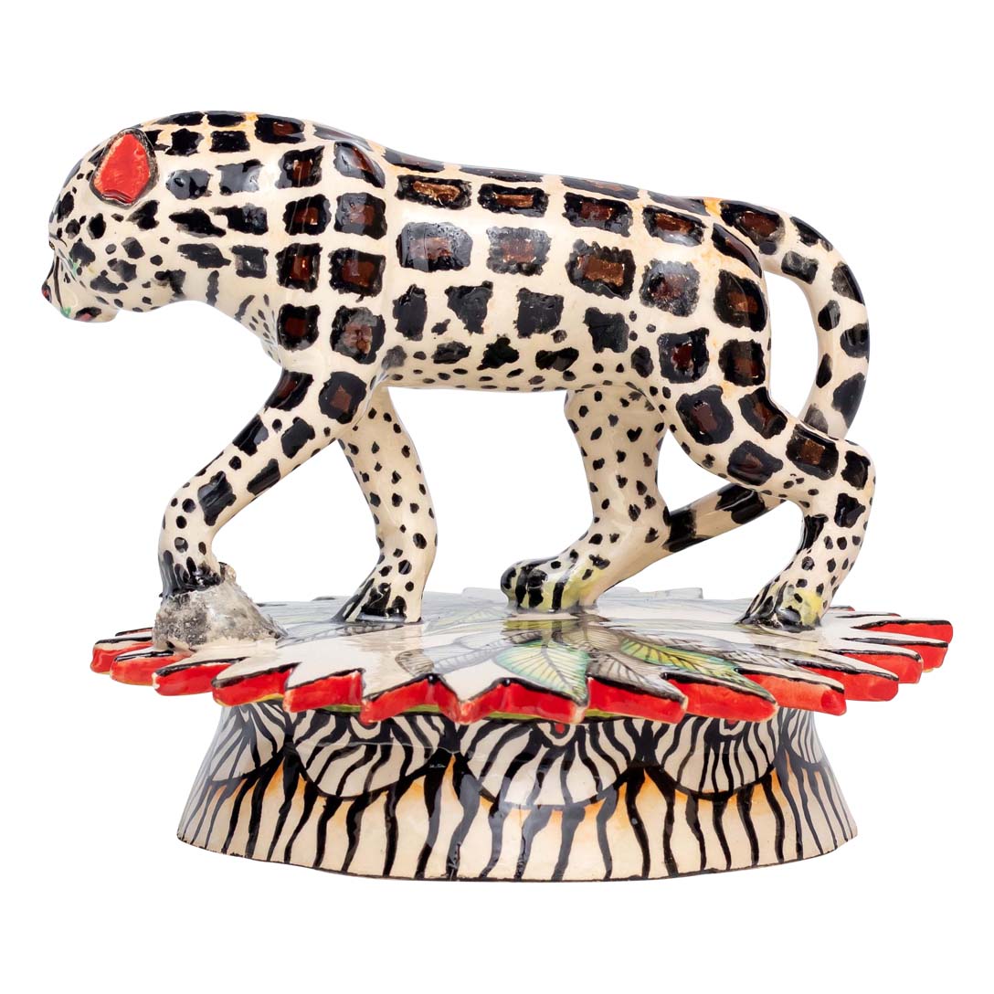 Skin designed leopard walking in his place sculpture