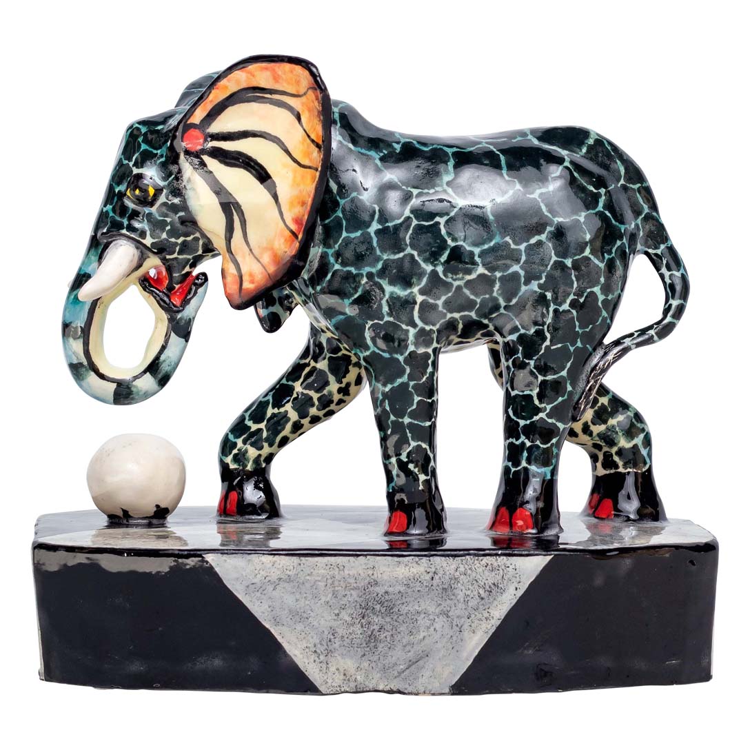 Skin designed elephant playing with the ball alone sculpture