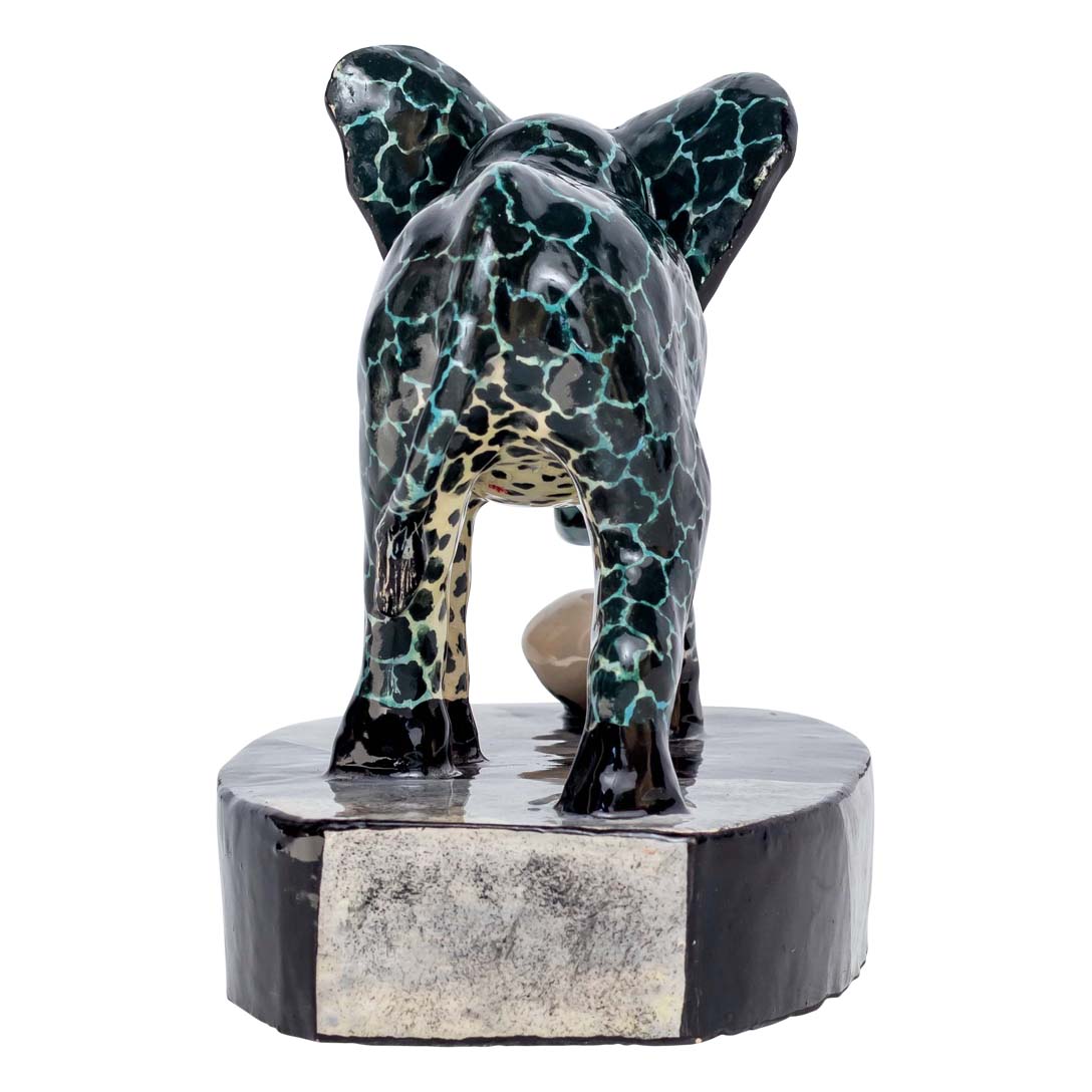 Skin designed elephant playing with the ball alone sculpture