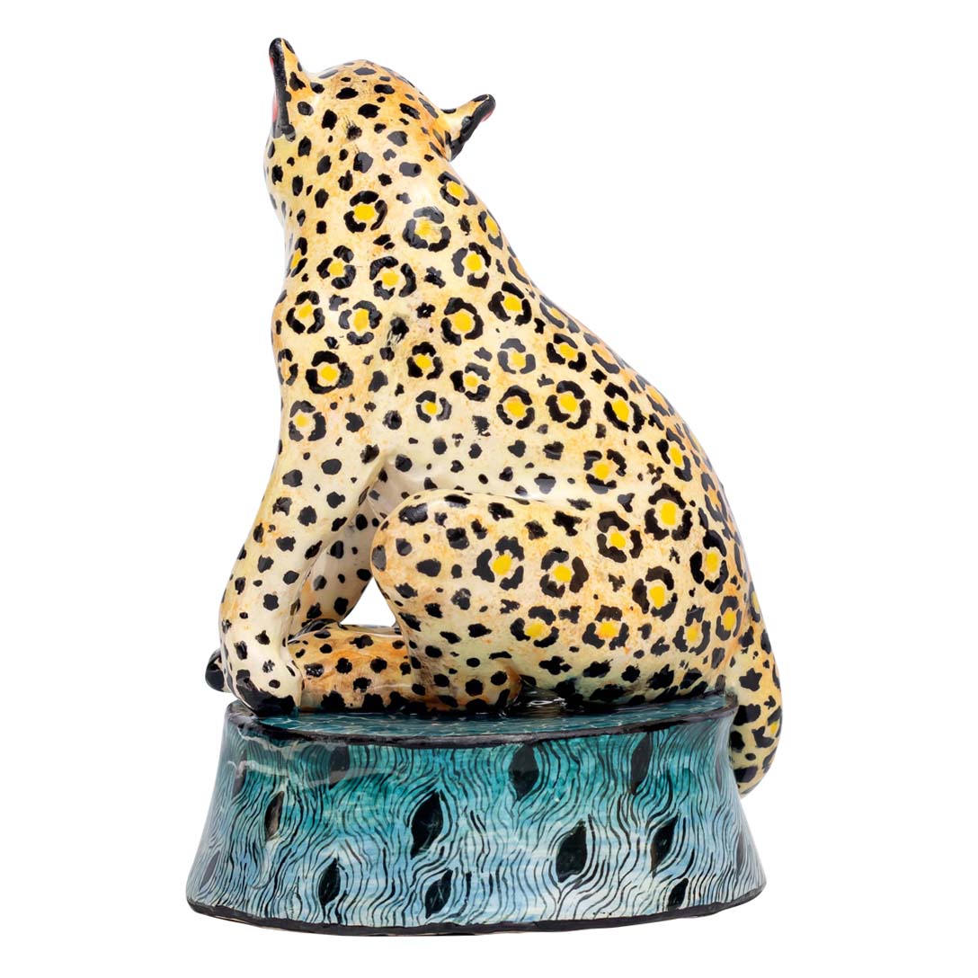 Leopard sitting and enjoying the view sculpture