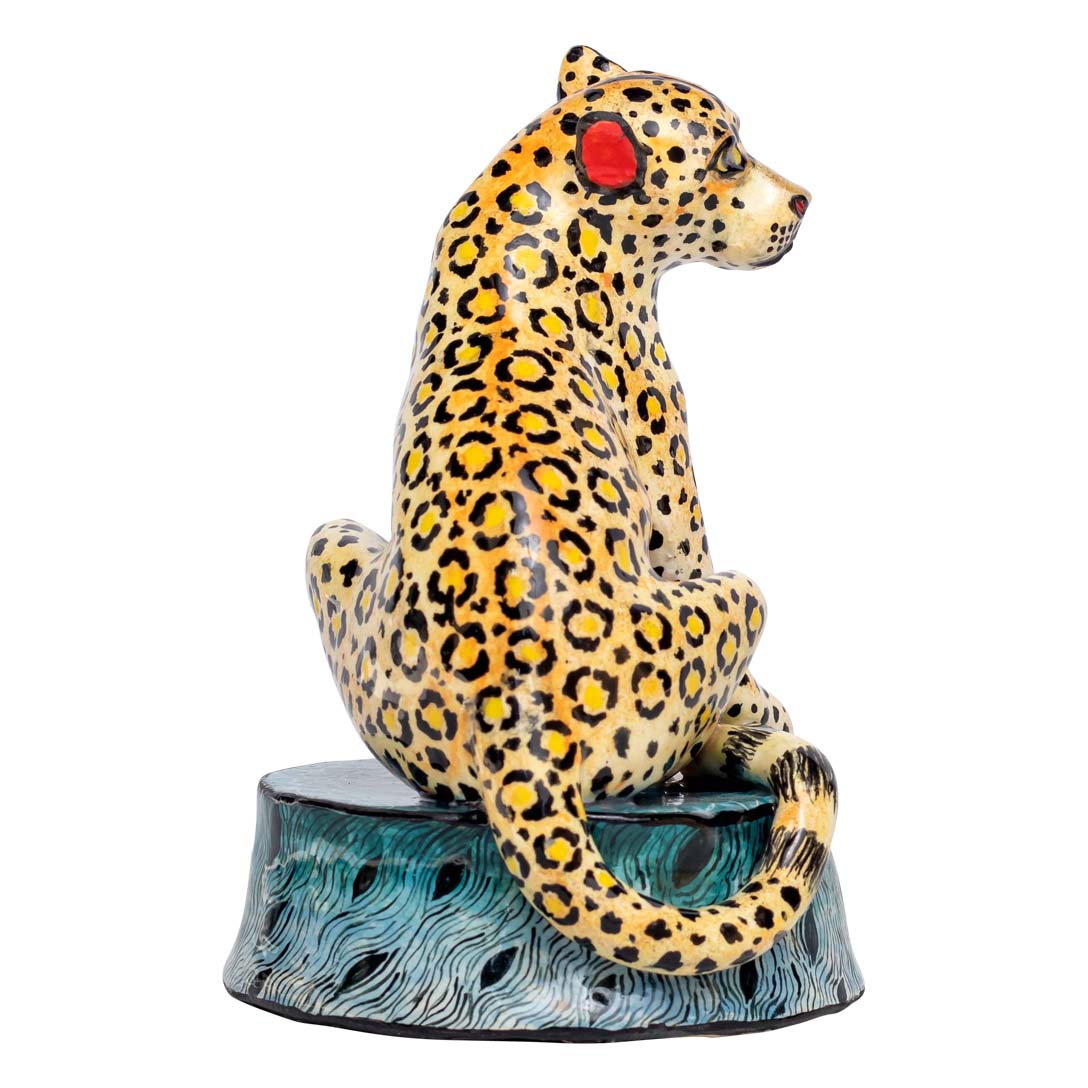 Leopard sitting and enjoying the view sculpture