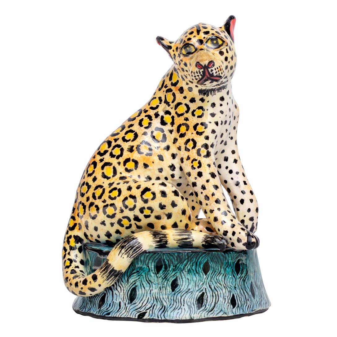 Leopard sitting and enjoying the view sculpture