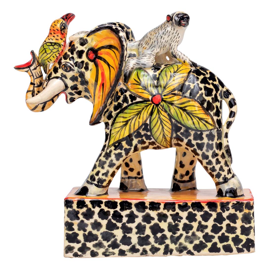 Monkey riding a skin designed elephant sculpture