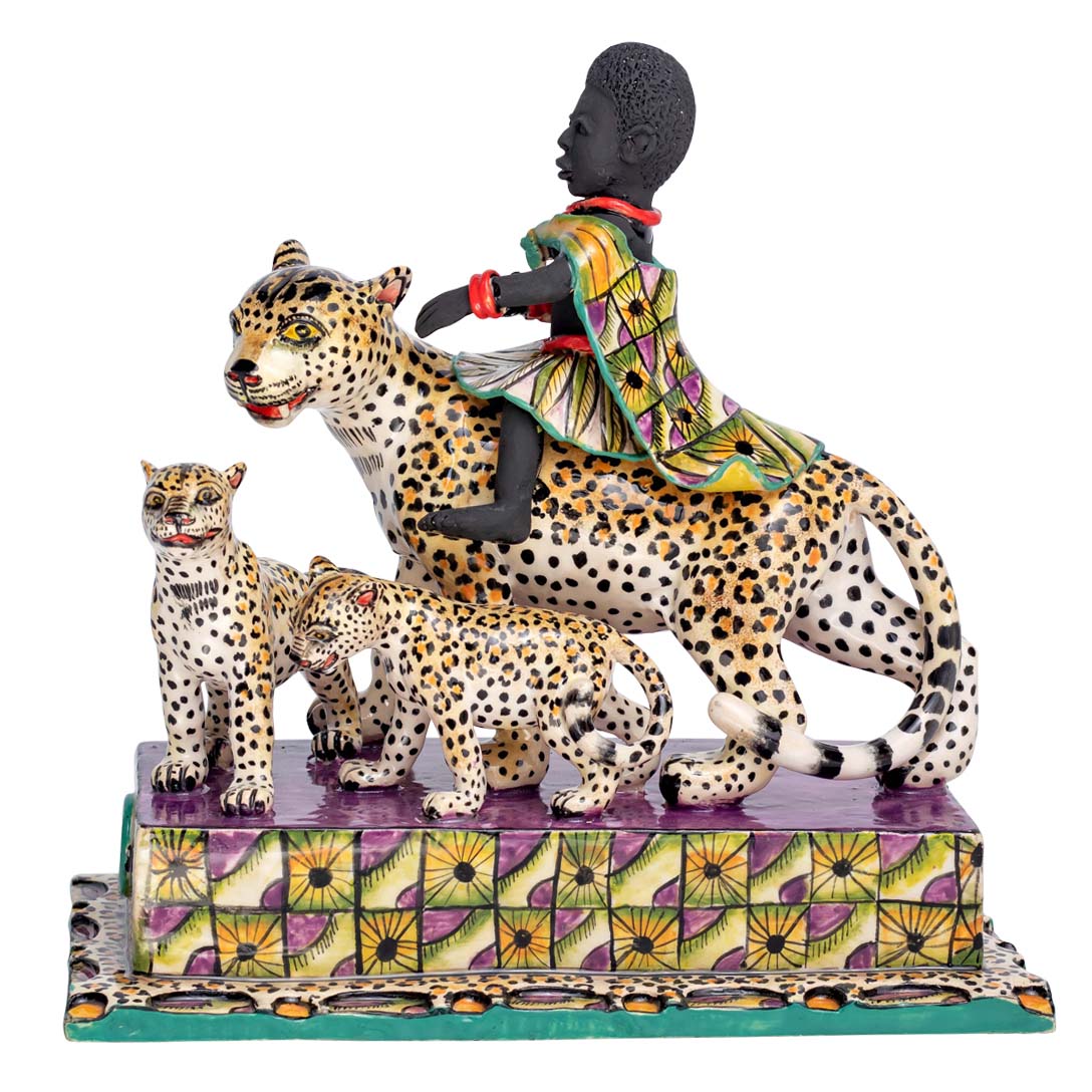 African women riding a leopard which is accompanied by its calves sculpture