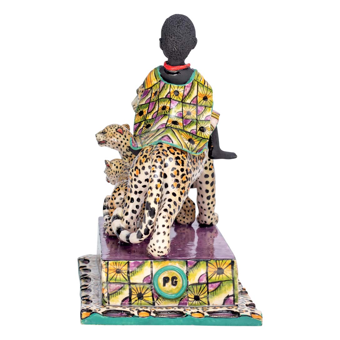 African women riding a leopard which is accompanied by its calves sculpture