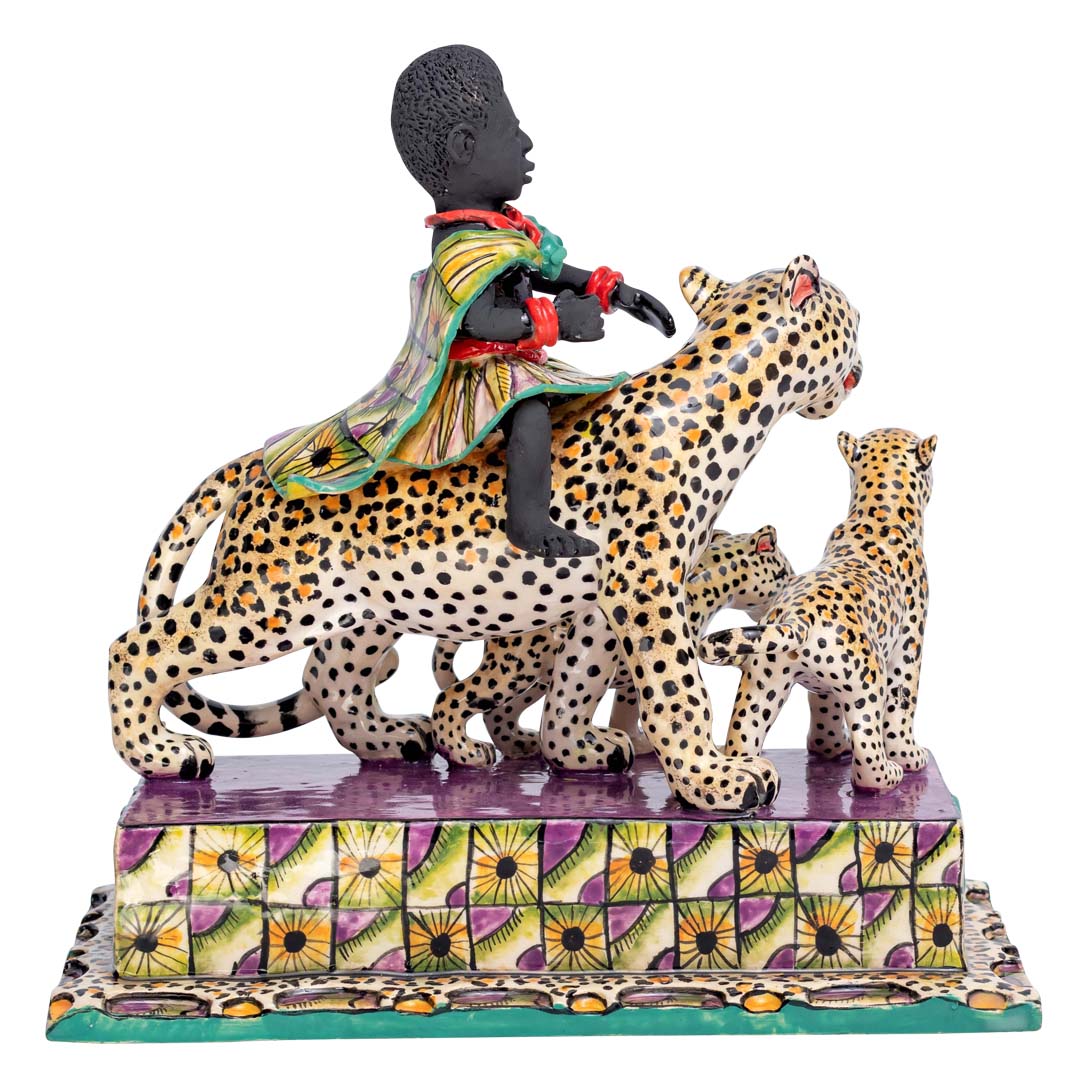 African women riding a leopard which is accompanied by its calves sculpture