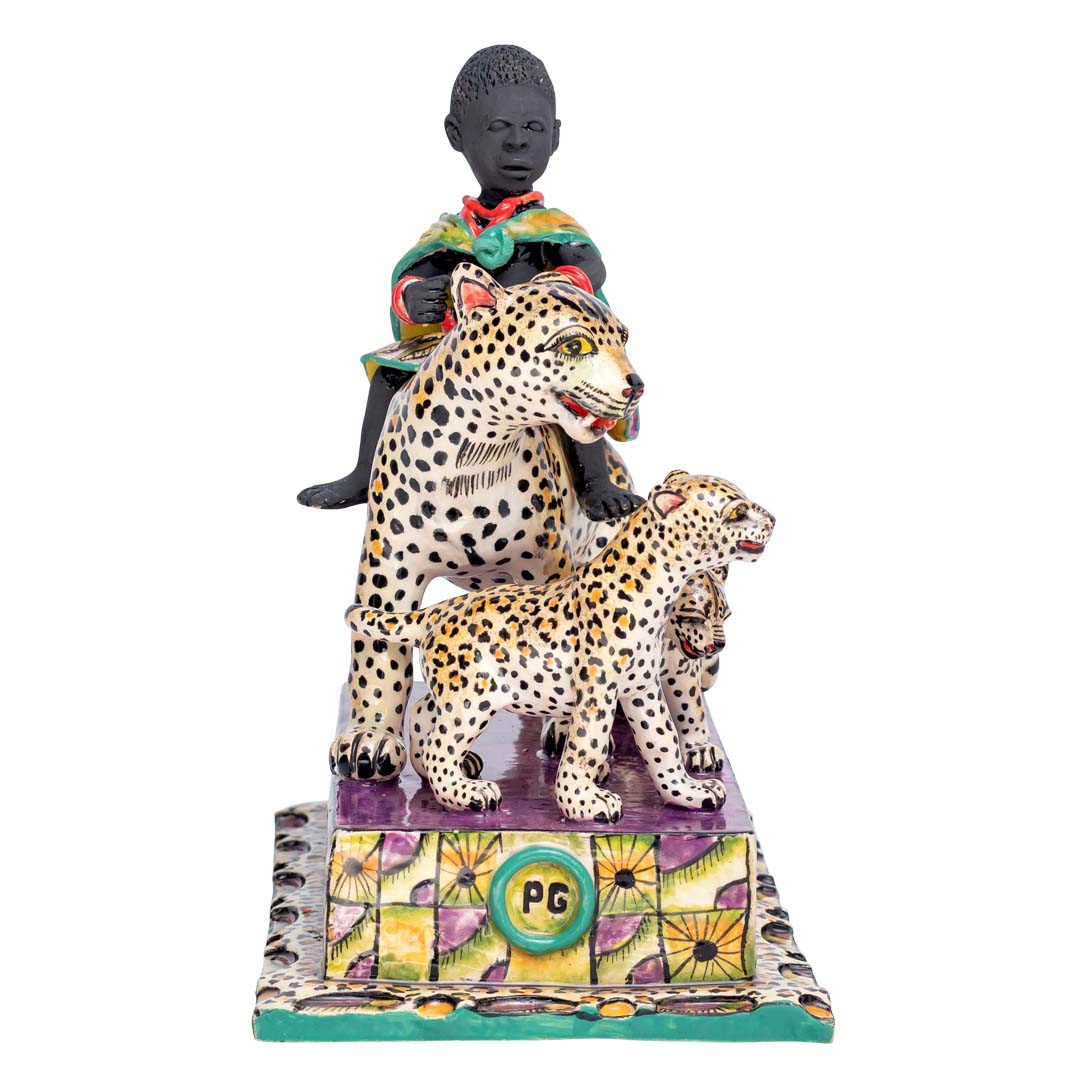 African women riding a leopard which is accompanied by its calves sculpture