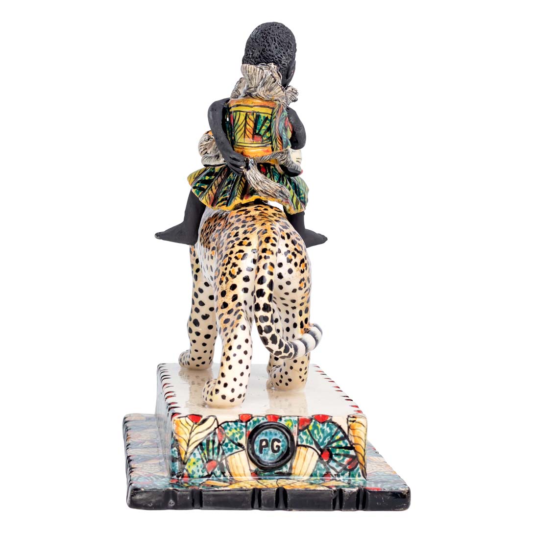 African women & 2 rabbits riding a leopard holding an umbrella sculpture