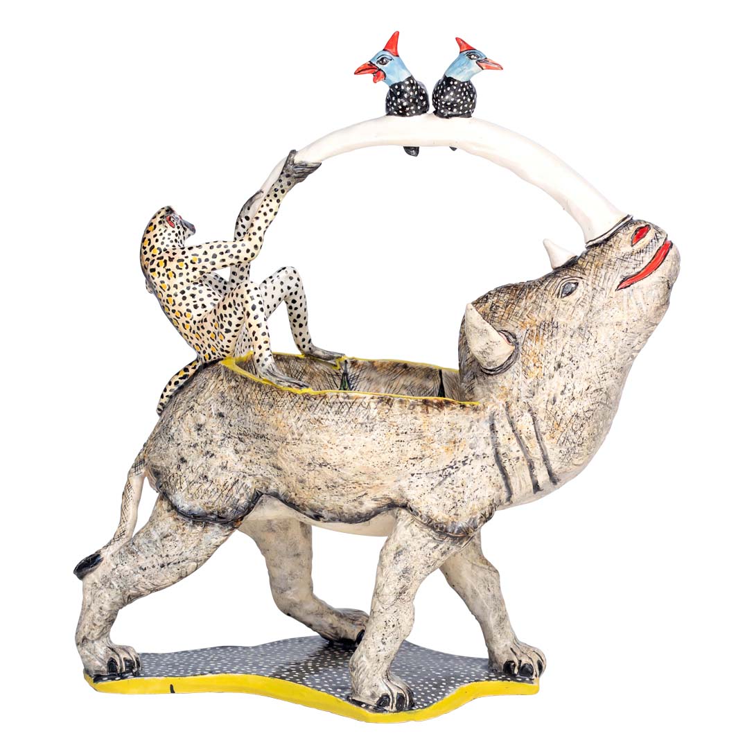 2 guineafowls standing on the rhino's horn pulled by a monkey designed peanut bowl