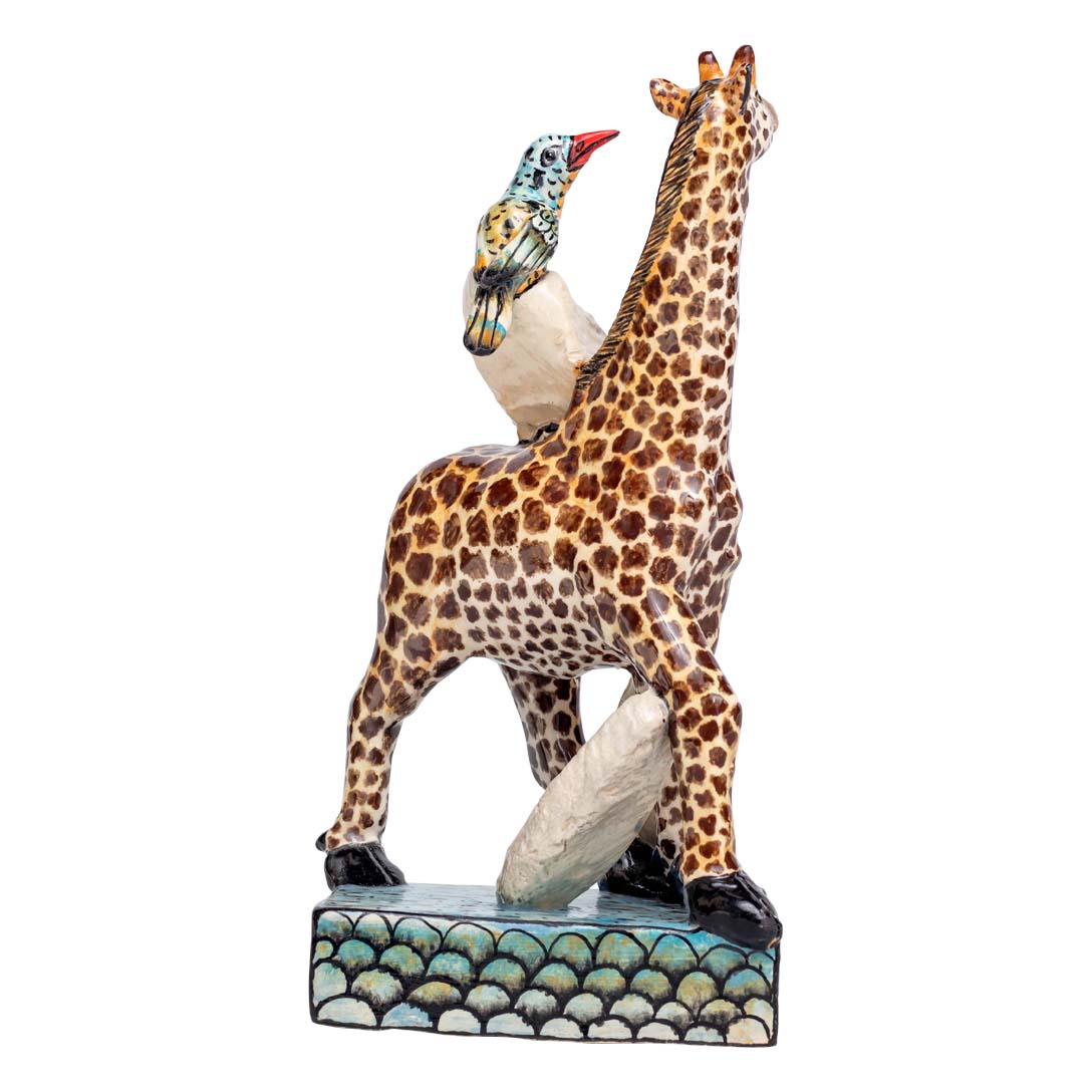 Giraffe & bird sculpture with stones sculpture