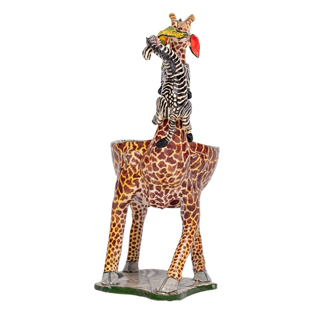 Zebra climbing a giraffe designed peanut bowl