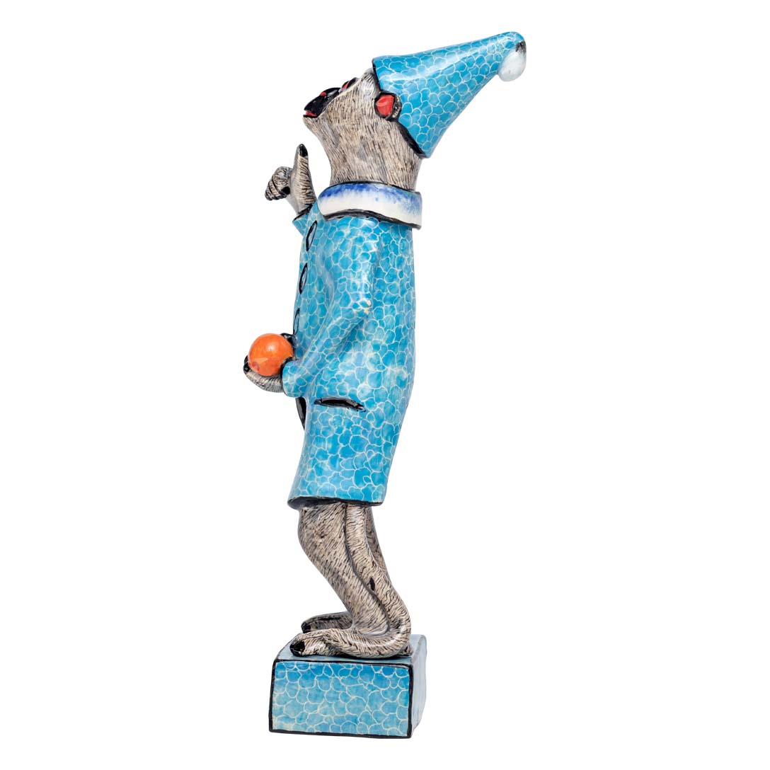 Monkey man wearing blue coat holding a ball sculpture