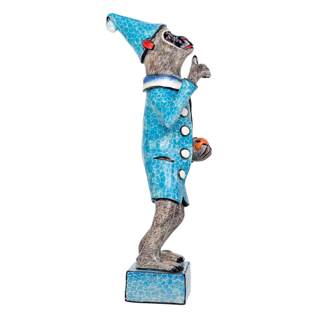 Monkey man wearing blue coat holding a ball sculpture