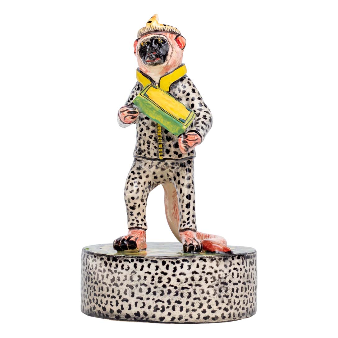 Monkey man wearing dalmatian designed clothes sculler