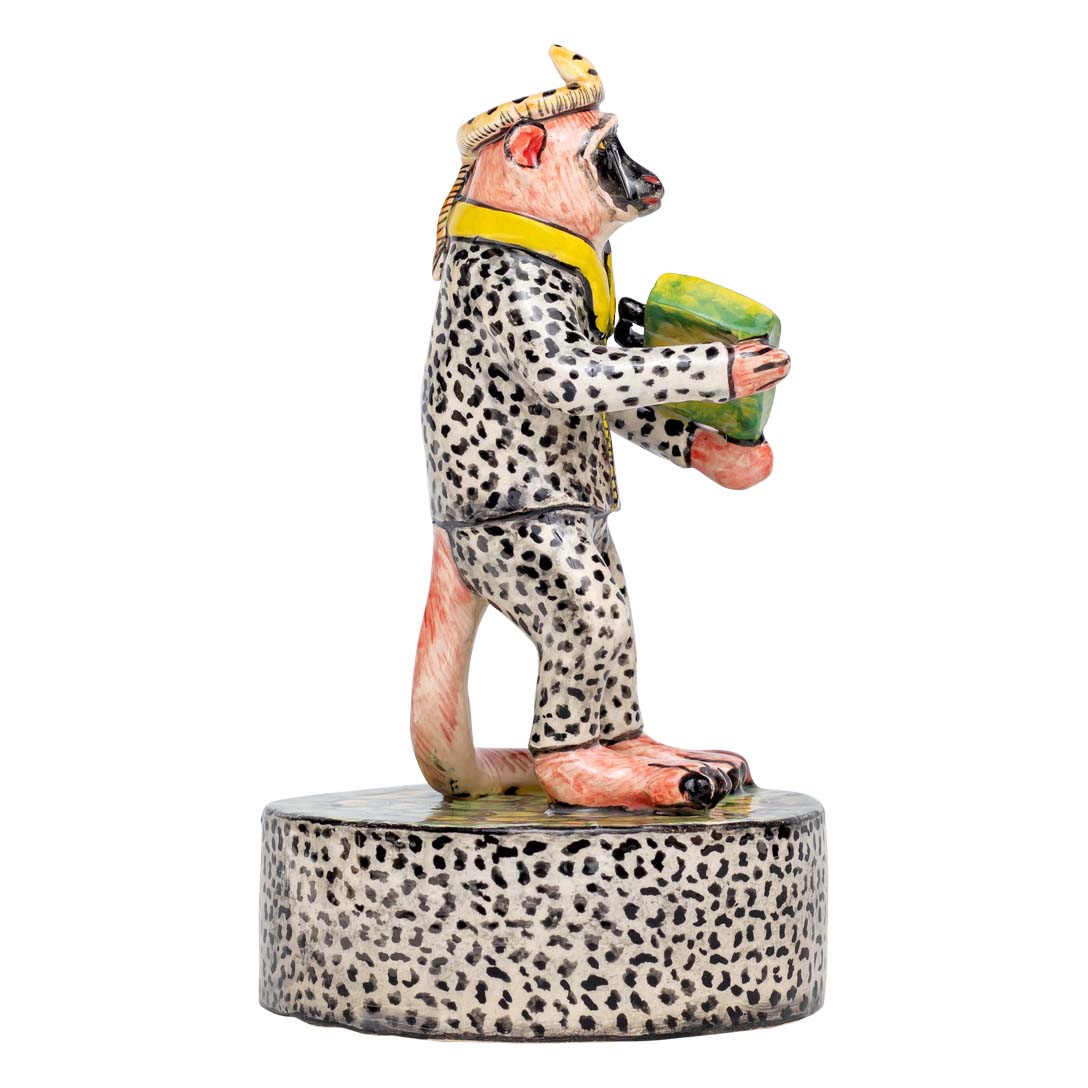 Monkey man wearing dalmatian designed clothes sculler