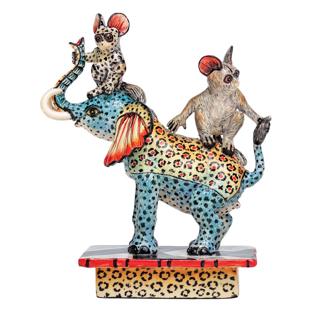 Bush babies ridding an elephant sculpture