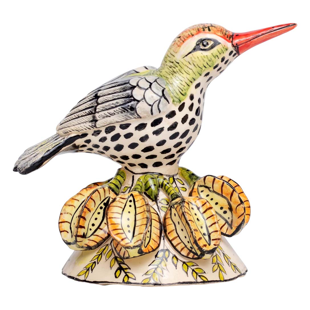 Sun bird sitting on a leaf sculpture