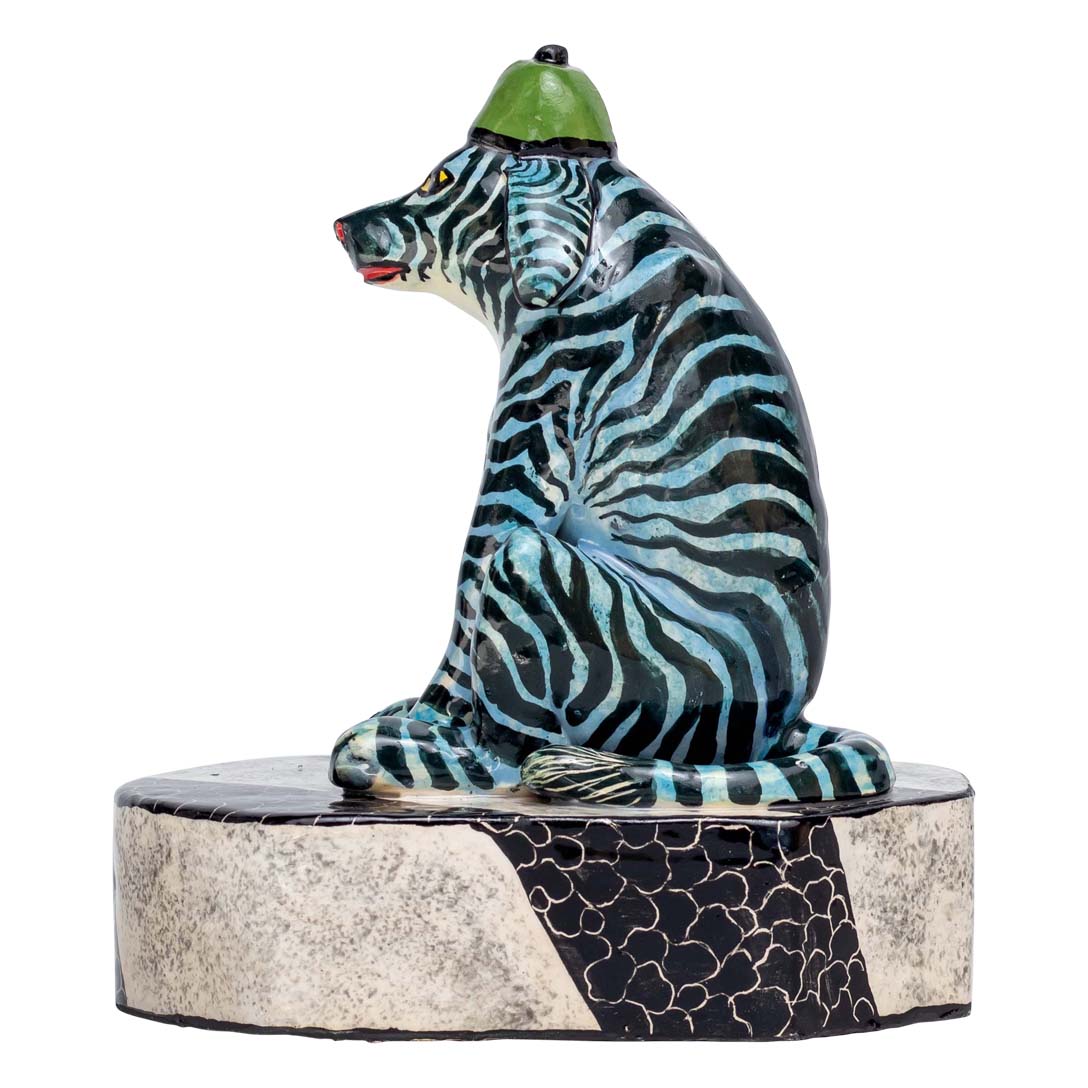 Unique zebra skin designed dog wearing a hat is sitting & relaxed sculpture