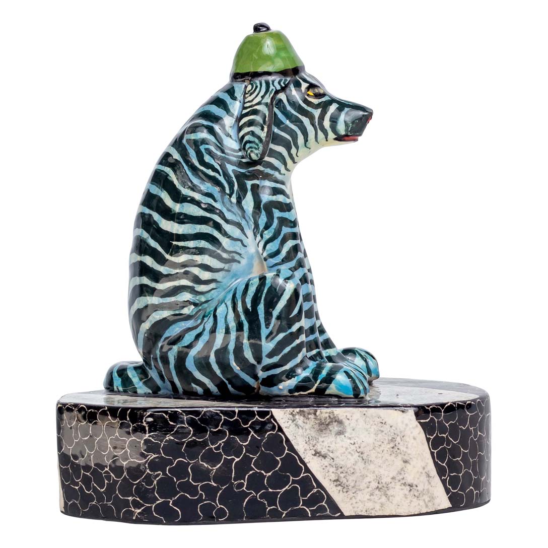 Unique zebra skin designed dog wearing a hat is sitting & relaxed sculpture